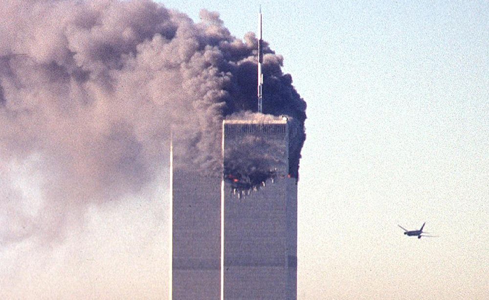 A hijacked commercial plane approaches the World Trade Center shortly before crashing into the landmark skyscraper 11 September 2001 in New York. AFP PHOTO SETH MCALLISTER