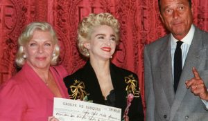 American rock star Madonna (C) smiles as she hands a 500,000 French francs to Line Renaud (L), a donation for research into the killer desease AIDS at Hotel Matignon August 28, 1987 in the presence of Prime Minister Jacques Chirac. Reuters/Jack Dabbaghian /Landov