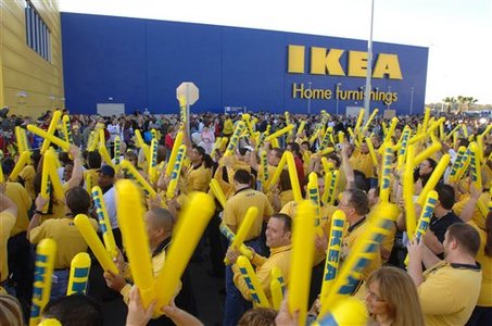 In this photo provided by IKEA, employees help pump up the crowd waiting to enter the new IKEA store during grand-opening ceremonies in Orlando, Fla., Wednesday, Nov. 14, 2007. The store is only the second to open in as many months in the state as the Swedish-based company expands into the United States. (AP Photo/Phelan M. Ebenhack, IKEA)